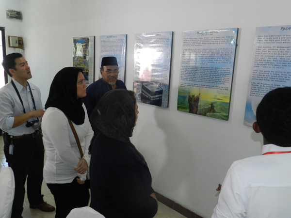 Senior Trustee of the Mosque Farook Latiff with the tour group