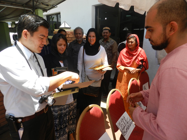 Tour group with calligraphy of their names done by Huzni Naeem